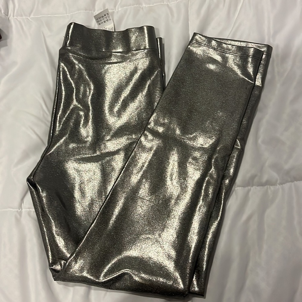 Sparkling silver leather pants, small to little stretch but very comfortable.